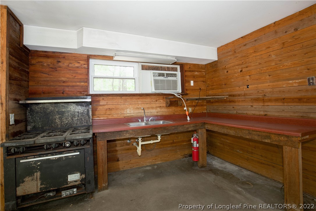 453 Heritage Farm Road Carthage, NC 28327 - Photo 10 of 50 a room with storage and a stove