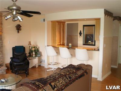 5219 Springmill Road Whitehall, PA 18052 - Photo 15 of 40 a living room with furniture and a lamp