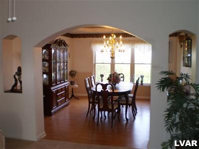 5219 Springmill Road Whitehall, PA 18052 - Photo 22 of 40 a view of a dining room with furniture and chandelier