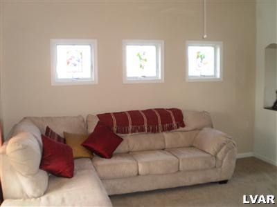 5219 Springmill Road Whitehall, PA 18052 - Photo 23 of 40 a living room with a couch and a window