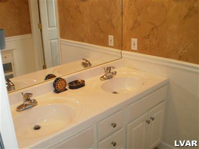 5219 Springmill Road Whitehall, PA 18052 - Photo 29 of 40 a bathroom with a sink and a tub