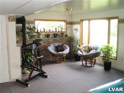 5219 Springmill Road Whitehall, PA 18052 - Photo 33 of 40 a living room with furniture and a window