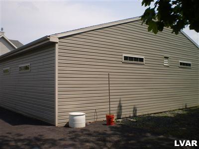5219 Springmill Road Whitehall, PA 18052 - Photo 40 of 40 a view of a white house with many windows