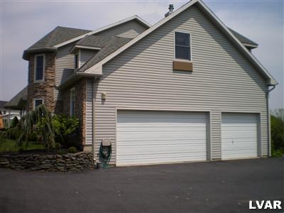5219 Springmill Road Whitehall, PA 18052 - Photo 5 of 40 a front view of a house with a garage