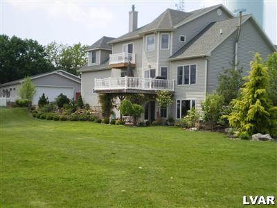 5219 Springmill Road Whitehall, PA 18052 - Photo 6 of 40 a front view of a house with a garden