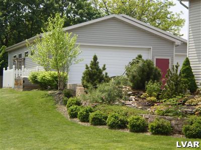 5219 Springmill Road Whitehall, PA 18052 - Photo 8 of 40 a house that has a lot of plants in it