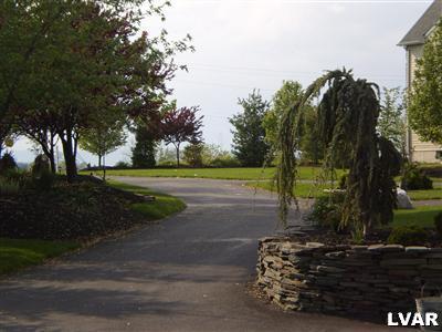 5219 Springmill Road Whitehall, PA 18052 - Photo 9 of 40 a view of a street with tree s