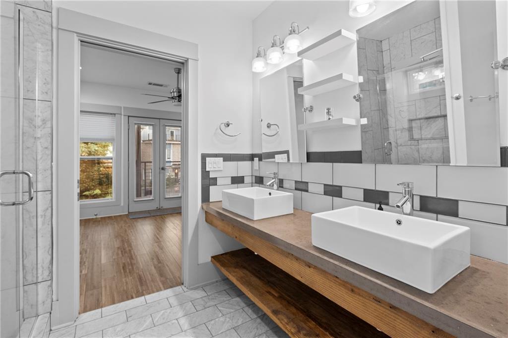 560 John Wesley Dobbs Avenue Northeast, Unit A Atlanta, GA 30312 - Photo 22 of 44 a bathroom with a sink and a mirror