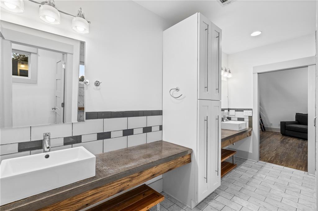 560 John Wesley Dobbs Avenue Northeast, Unit A Atlanta, GA 30312 - Photo 33 of 44 a view of bathroom with dual sinks