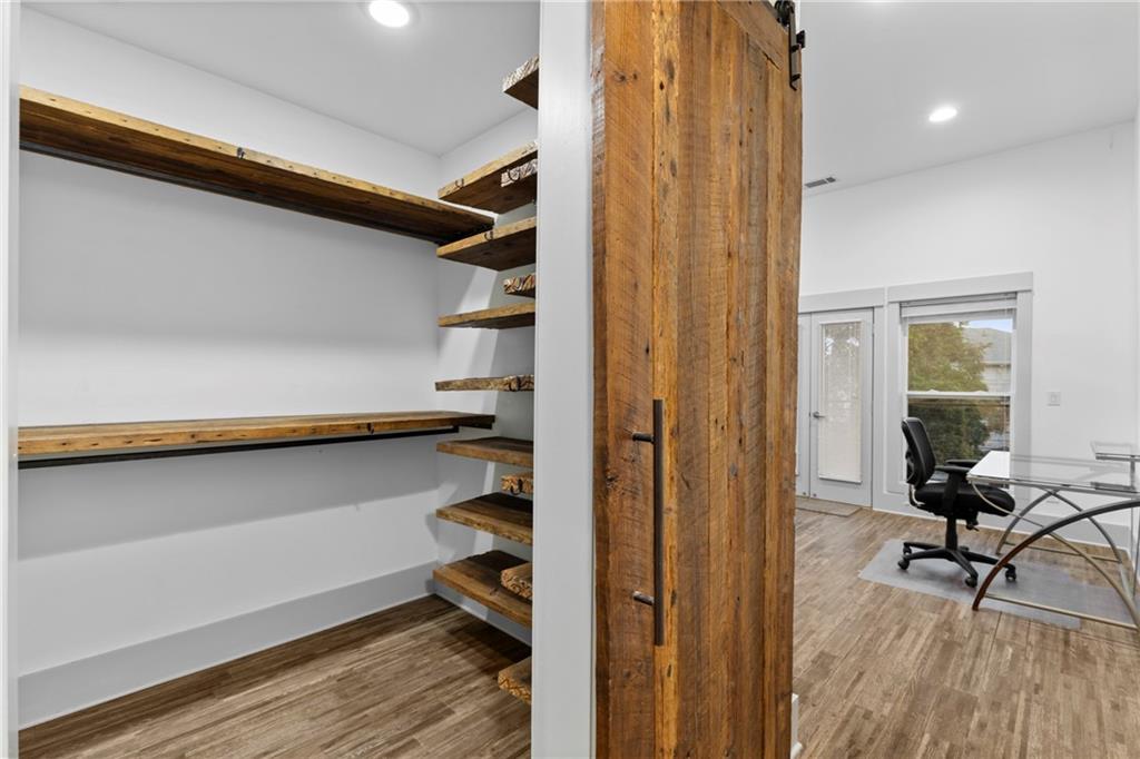560 John Wesley Dobbs Avenue Northeast, Unit A Atlanta, GA 30312 - Photo 34 of 44 a view of a hallway with wooden floor and a window