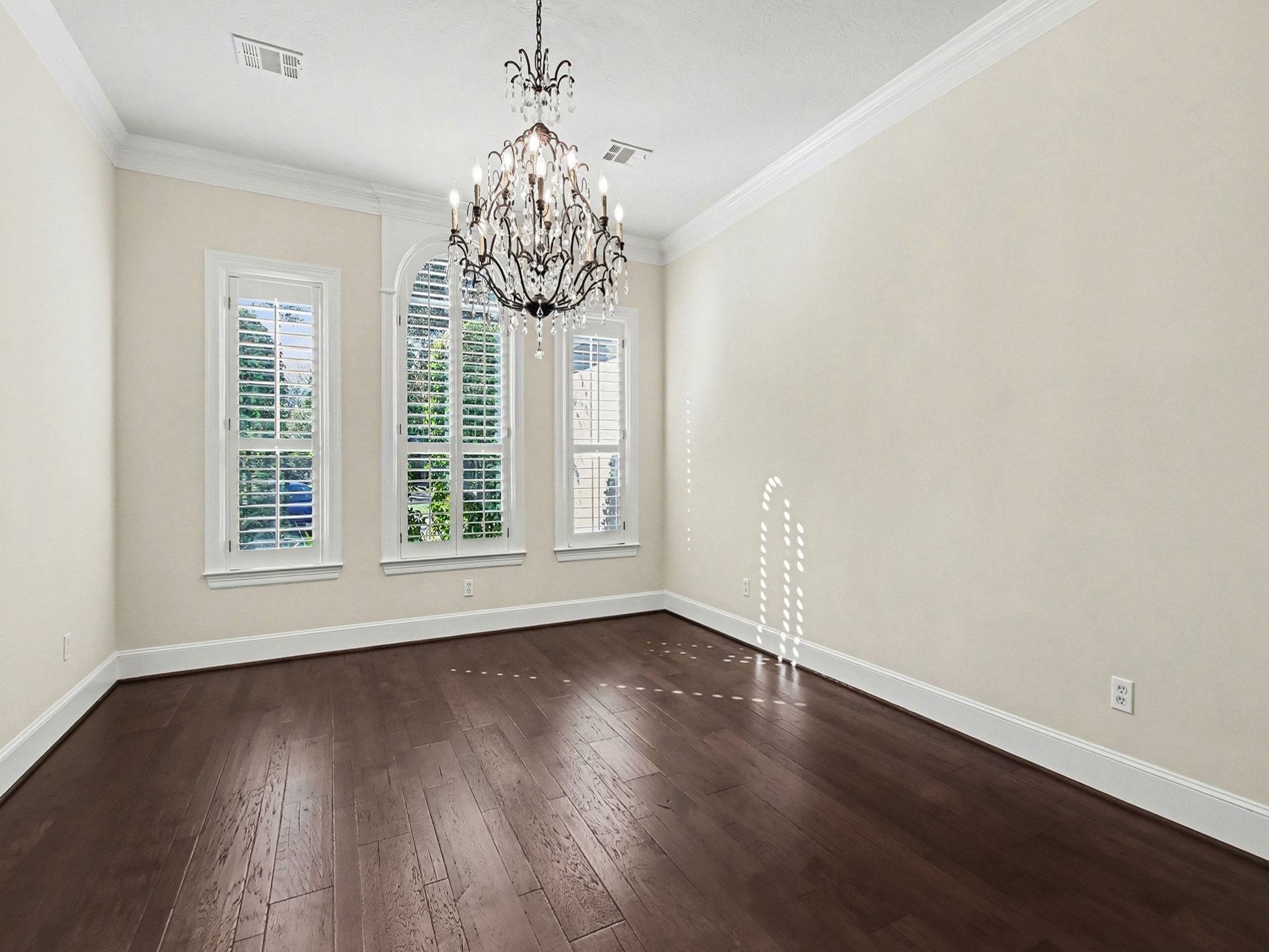 22918 Chaus Court Katy, TX 77494 - Photo 11 of 35 a view of an empty room with wooden floor and a window