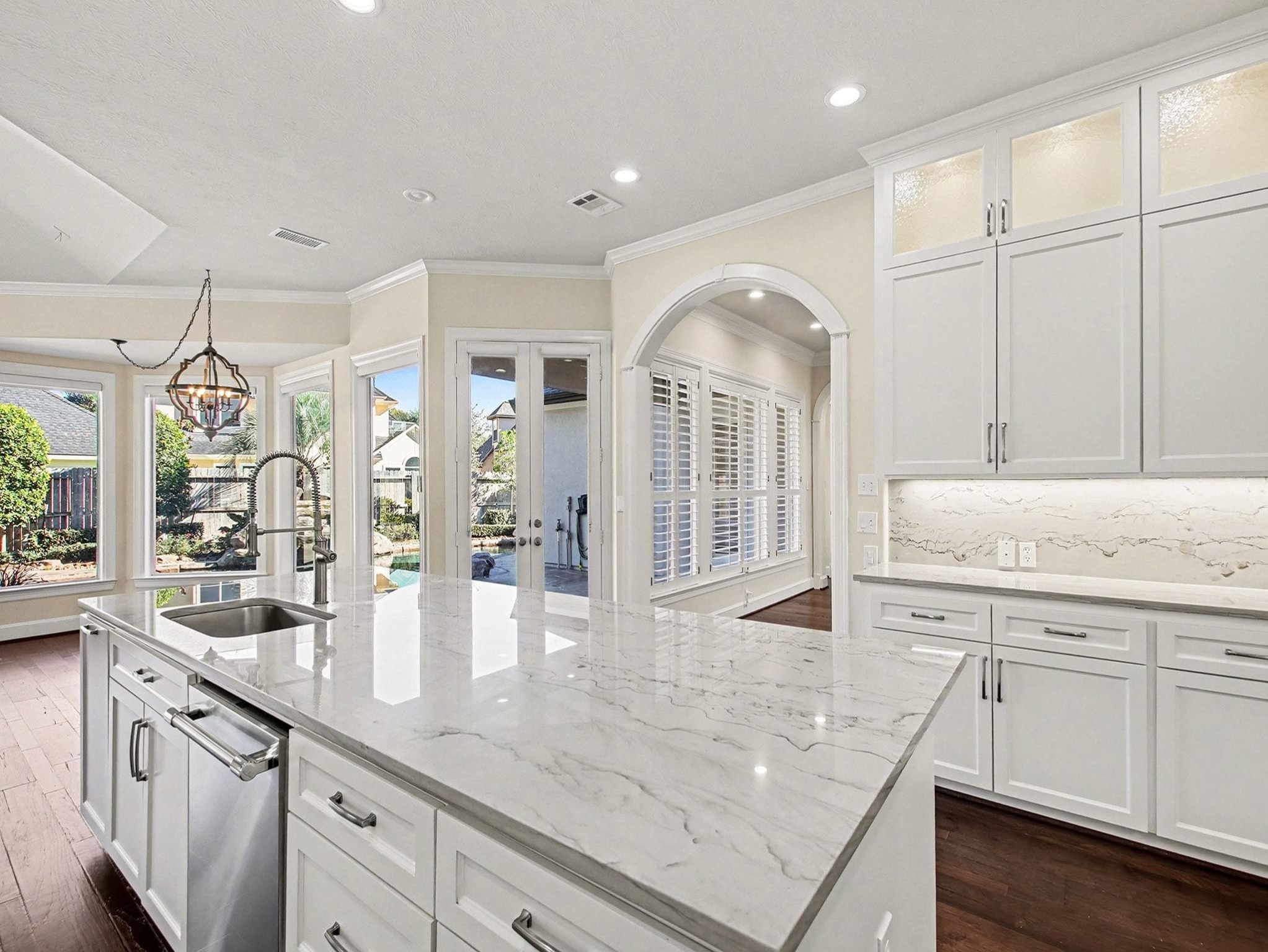 22918 Chaus Court Katy, TX 77494 - Photo 13 of 35 a kitchen with center island a sink stainless steel appliances and cabinets