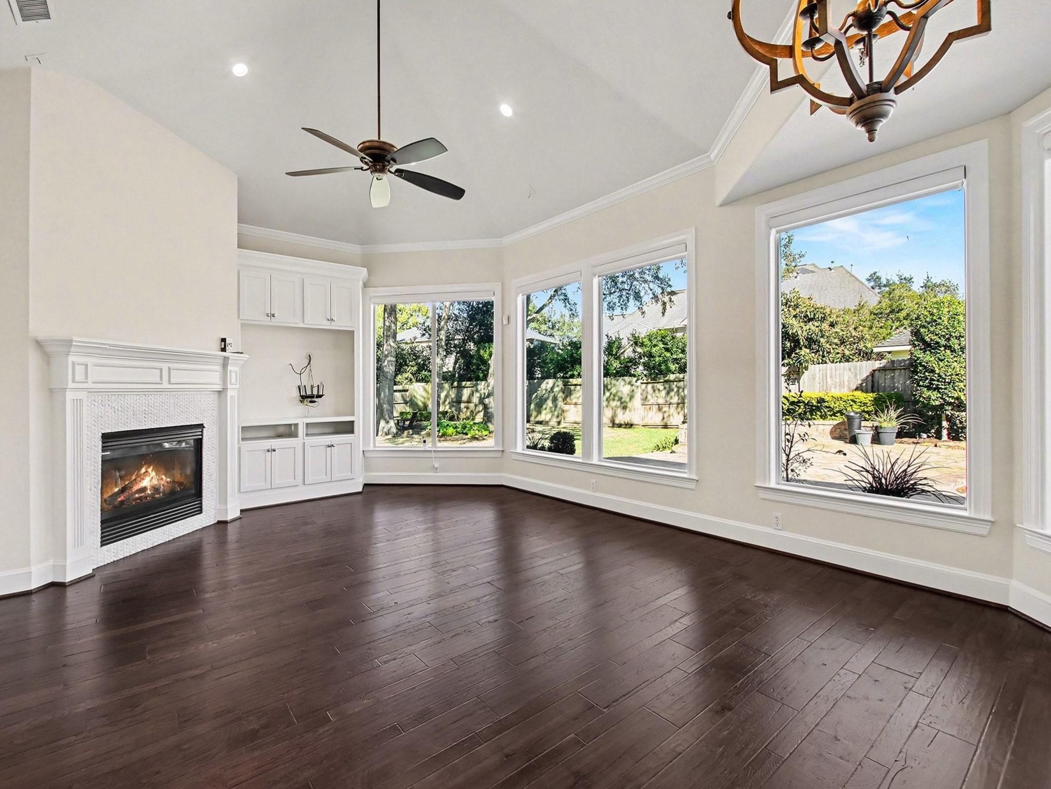 22918 Chaus Court Katy, TX 77494 - Photo 16 of 35 a view of an empty room with wooden floor fireplace and a window