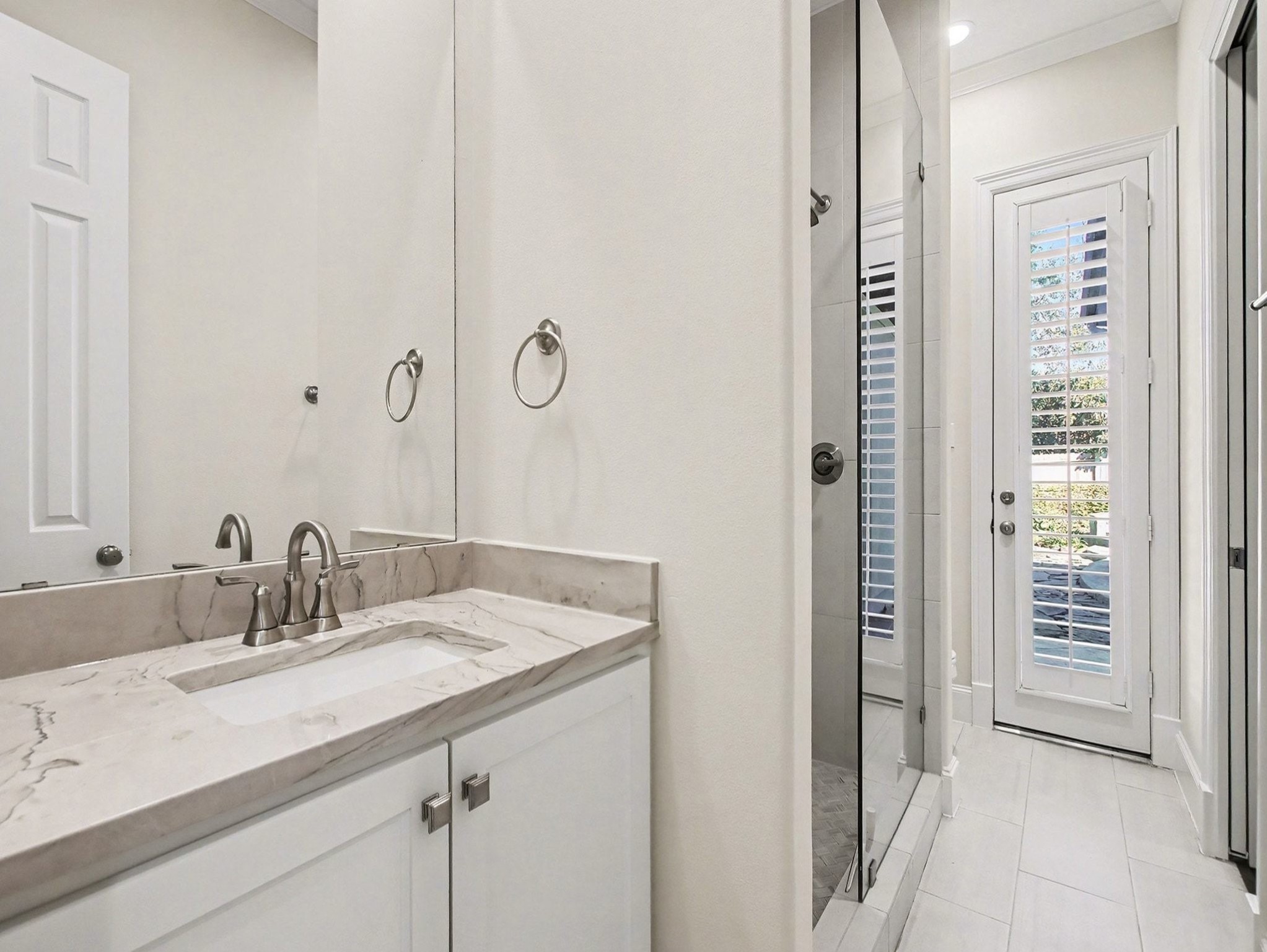 22918 Chaus Court Katy, TX 77494 - Photo 18 of 35 a bathroom with a sink and a mirror