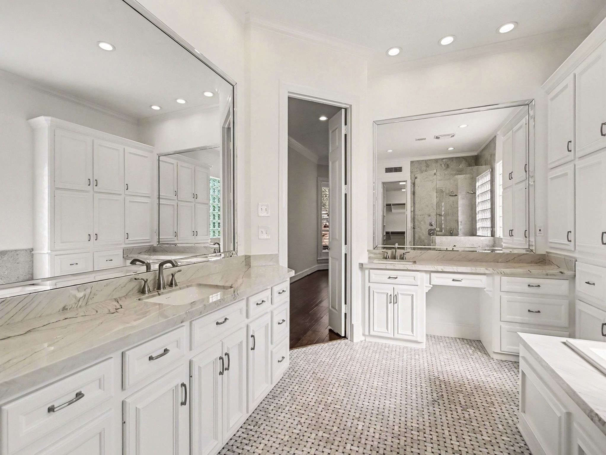 22918 Chaus Court Katy, TX 77494 - Photo 24 of 35 a large bathroom with a granite countertop double vanity sink a mirror and a bathtub