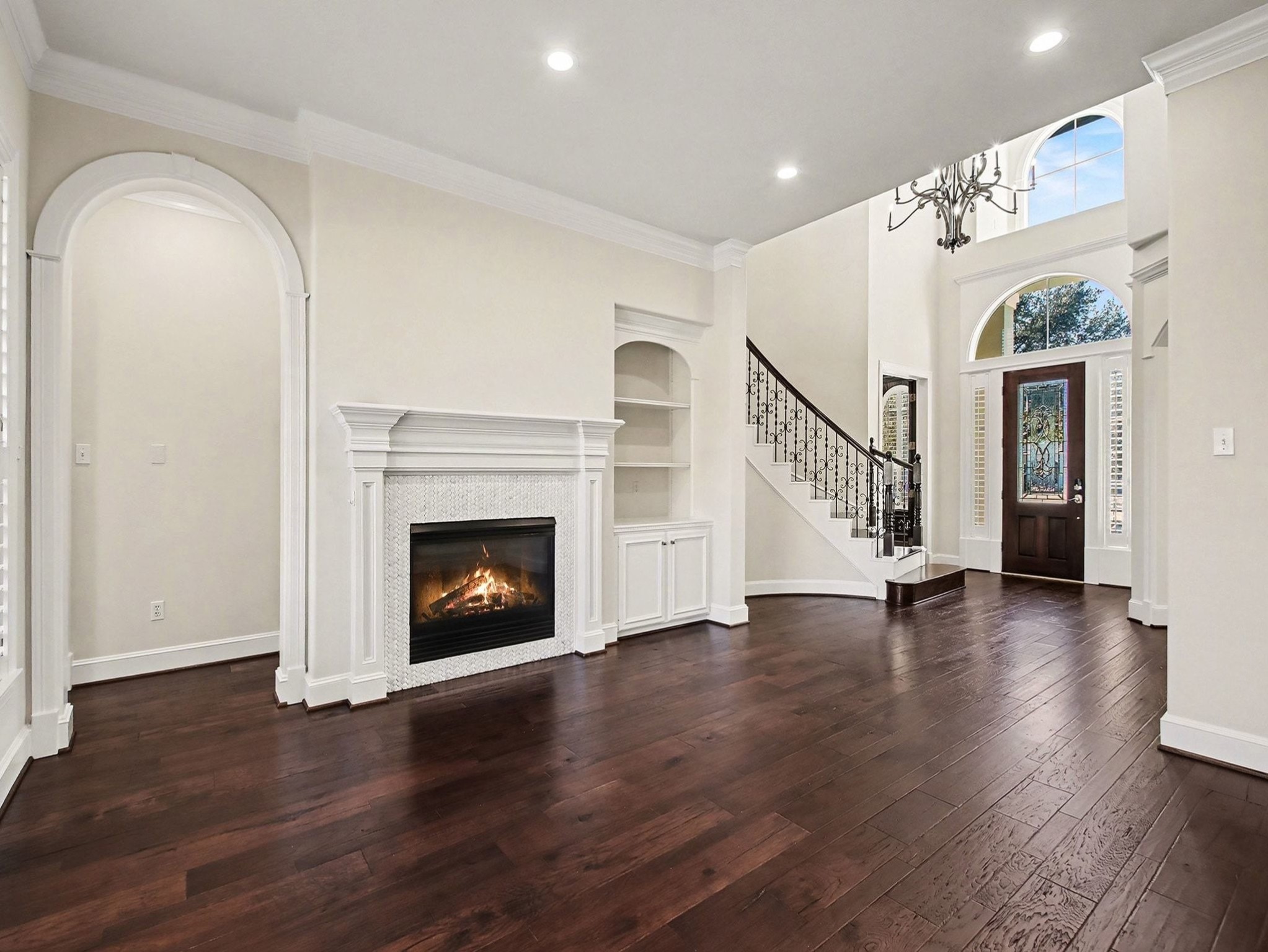 22918 Chaus Court Katy, TX 77494 - Photo 9 of 35 a view of an empty room with wooden floor fireplace and a window