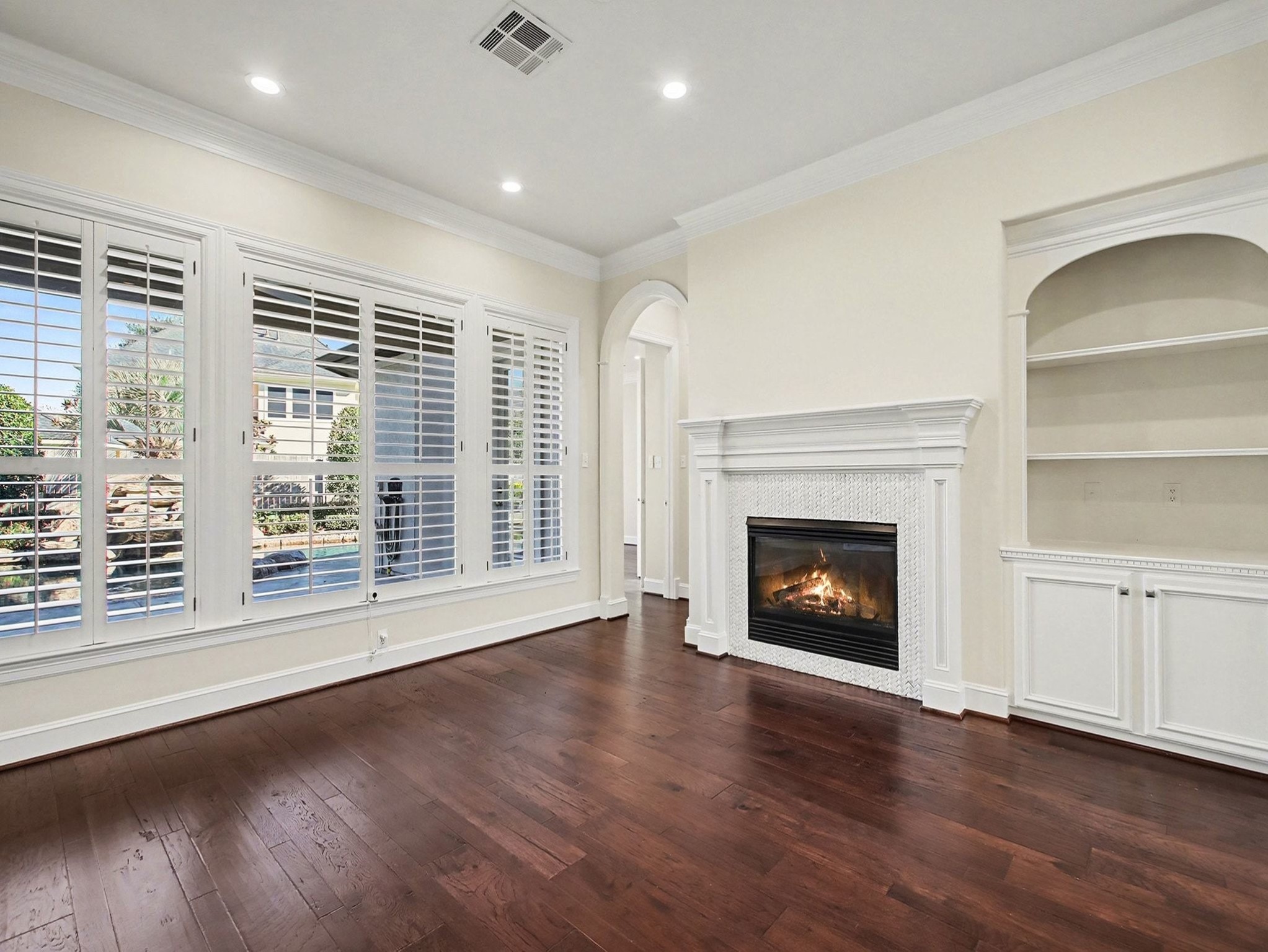 22918 Chaus Court Katy, TX 77494 - Photo 10 of 35 a view of an empty room with a fireplace and a window
