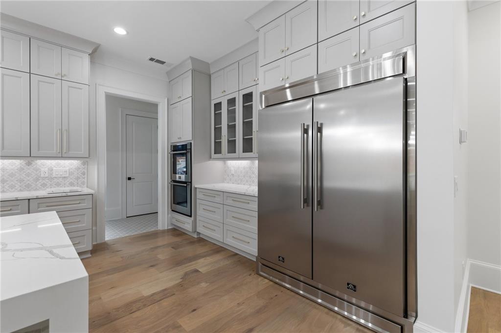 461 Harry McCarty Road Bethlehem, GA 30620 - Photo 20 of 78 a kitchen with stainless steel appliances granite countertop a refrigerator and a sink