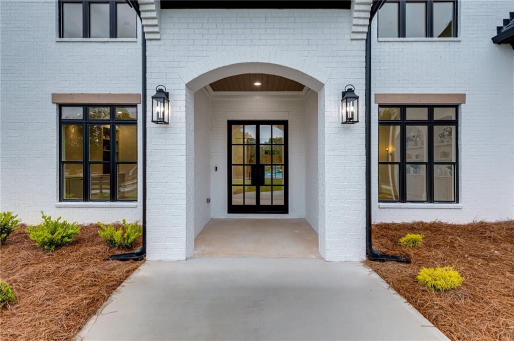 461 Harry McCarty Road Bethlehem, GA 30620 - Photo 2 of 78 a front view of a house with large windows
