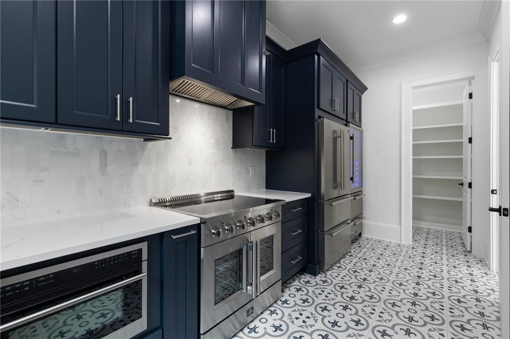 461 Harry McCarty Road Bethlehem, GA 30620 - Photo 25 of 78 a kitchen with a stove and a refrigerator