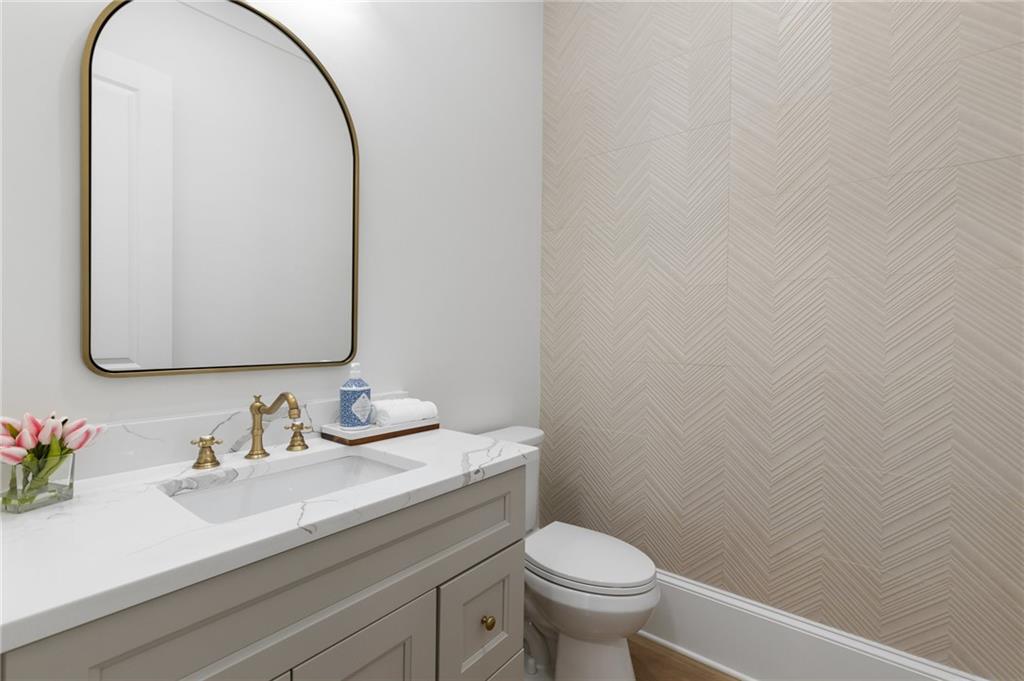 461 Harry McCarty Road Bethlehem, GA 30620 - Photo 27 of 78 a bathroom with a sink and a mirror