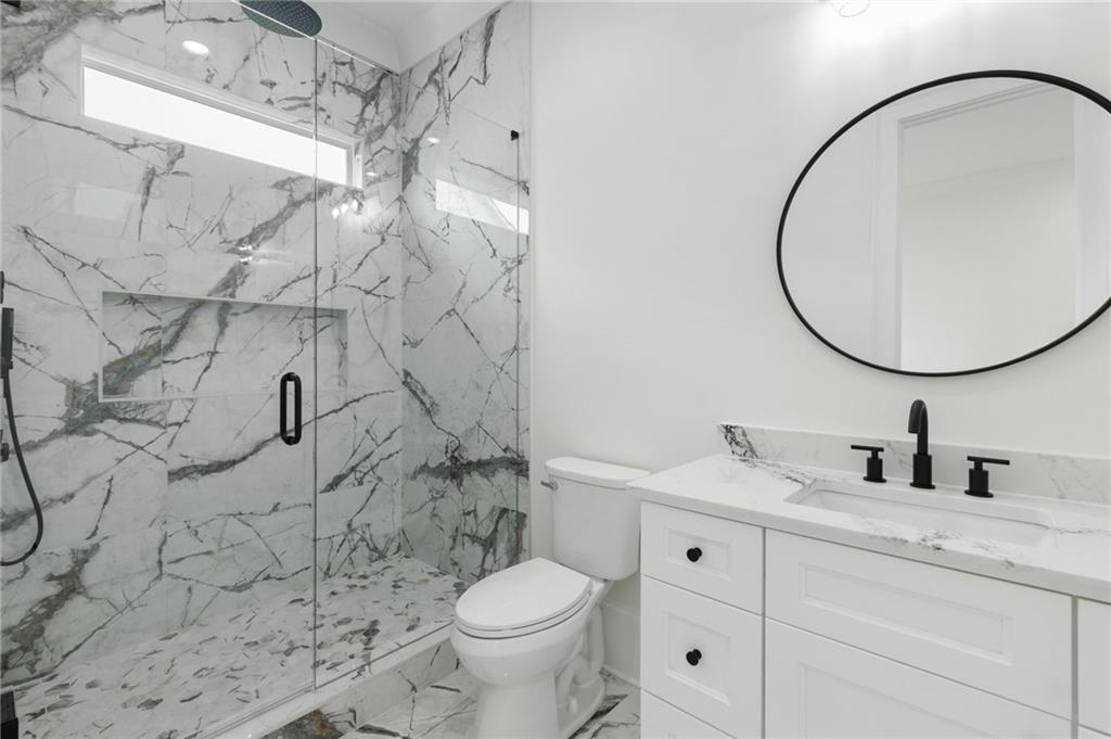 461 Harry McCarty Road Bethlehem, GA 30620 - Photo 30 of 78 a bathroom with a sink toilet and shower