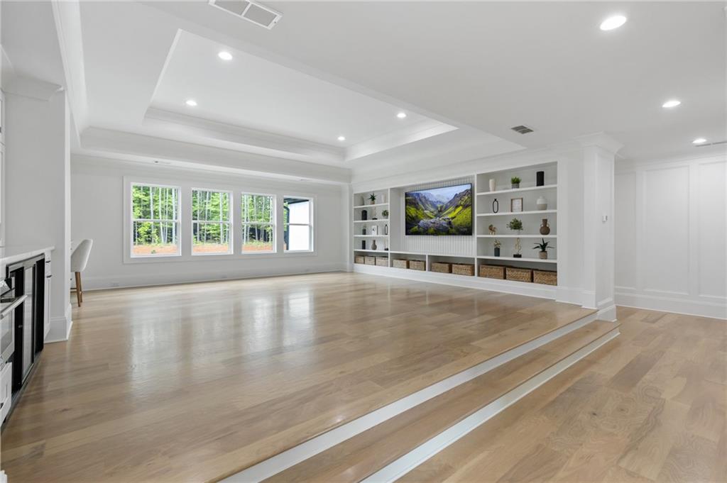 461 Harry McCarty Road Bethlehem, GA 30620 - Photo 32 of 78 an empty room with wooden floor and windows
