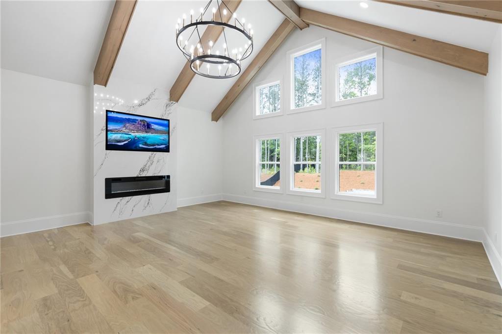 461 Harry McCarty Road Bethlehem, GA 30620 - Photo 37 of 78 a view of an empty room with wooden floor and a window