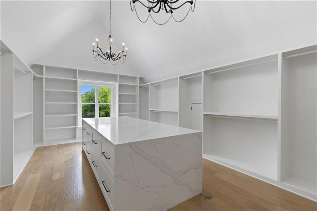 461 Harry McCarty Road Bethlehem, GA 30620 - Photo 44 of 78 a view of room with cabinets and wooden floor