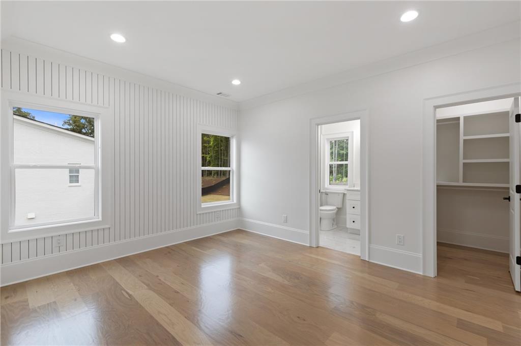 461 Harry McCarty Road Bethlehem, GA 30620 - Photo 52 of 78 an empty room with wooden floor and windows