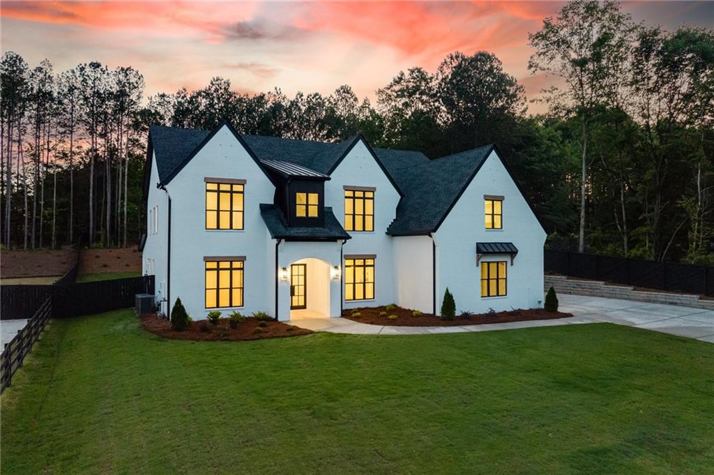 461 Harry McCarty Road Bethlehem, GA 30620 - Photo 76 of 78 a front view of a house with a yard and trees
