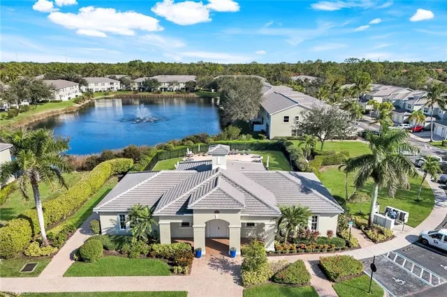 an aerial view of houses with yard