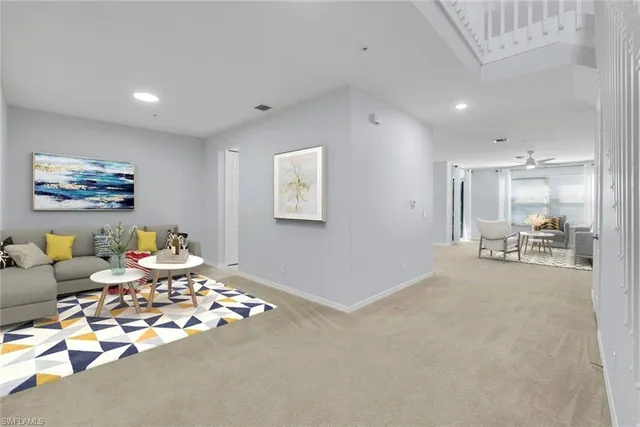 a living room with furniture and a table