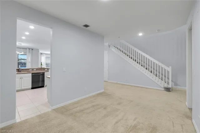 a view of entryway and kitchen