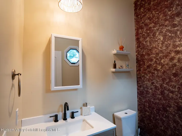 a bathroom with a toilet and a sink