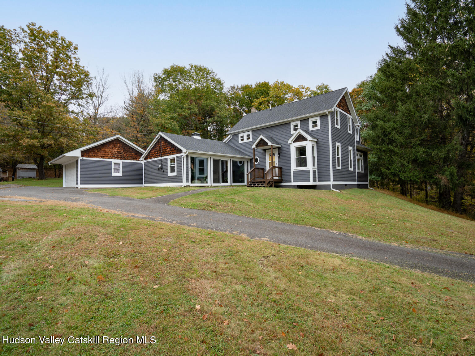 8 Creekside Road Hopewell Junction, NY 12533 - Photo 2 of 34 a view of a house with a big yard and large trees