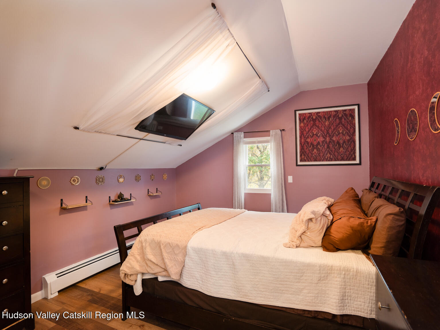 8 Creekside Road Hopewell Junction, NY 12533 - Photo 21 of 34 a bedroom with a bed and a painting on the wall