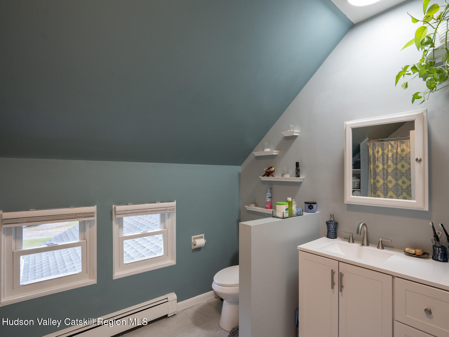 8 Creekside Road Hopewell Junction, NY 12533 - Photo 22 of 34 a bathroom with a toilet sink and mirror