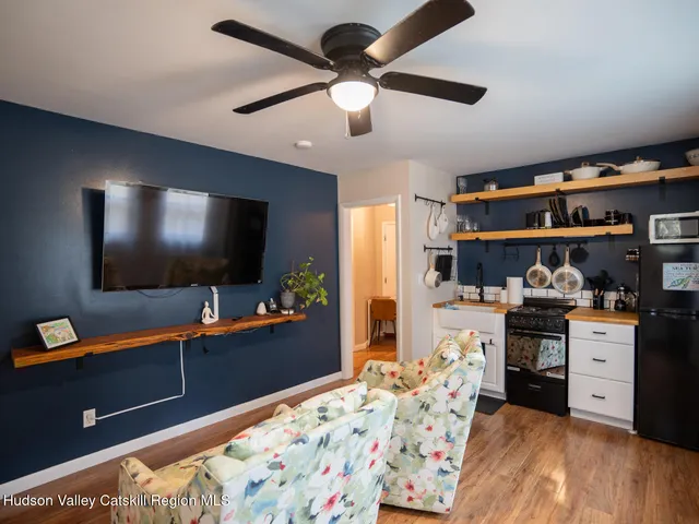 a bedroom with furniture and flat screen tv
