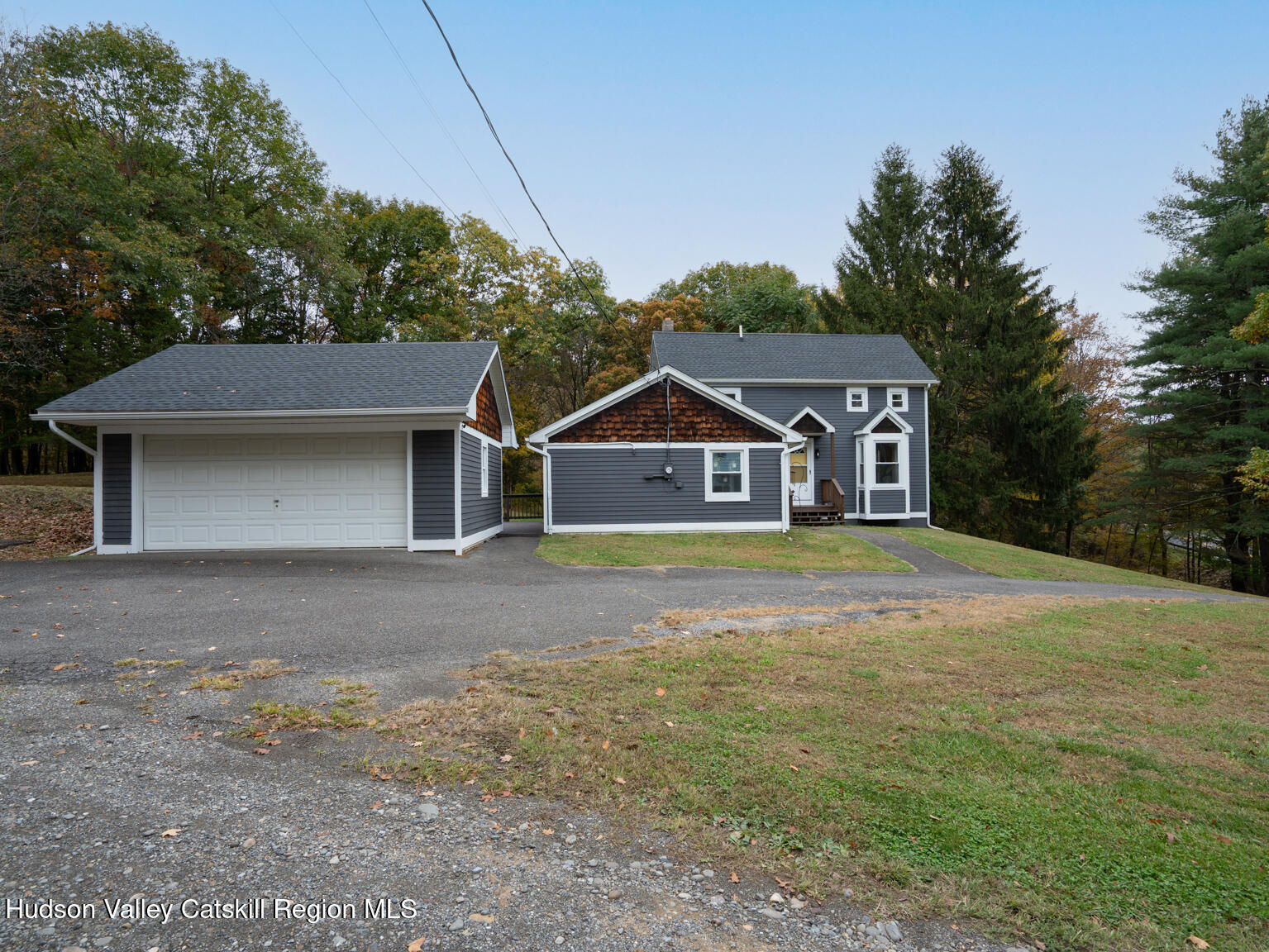 8 Creekside Road Hopewell Junction, NY 12533 - Photo 3 of 34 a house with trees in the background