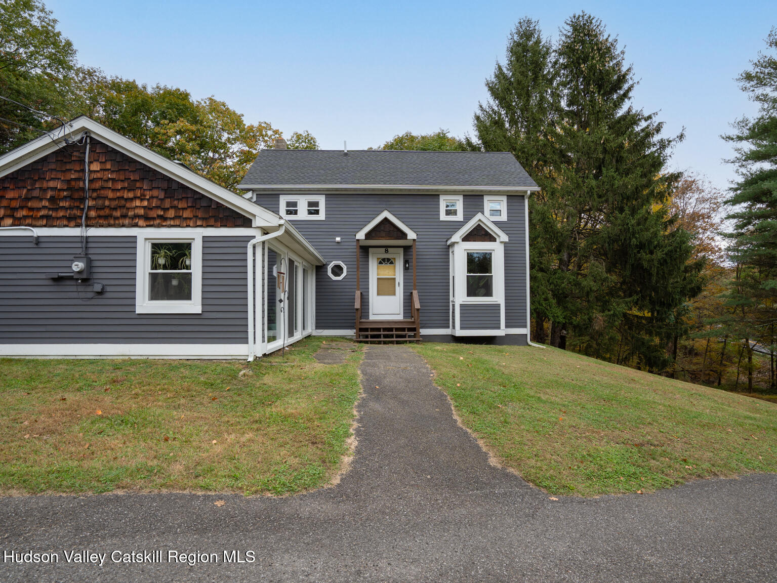 8 Creekside Road Hopewell Junction, NY 12533 - Photo 4 of 34 a front view of a house with garden