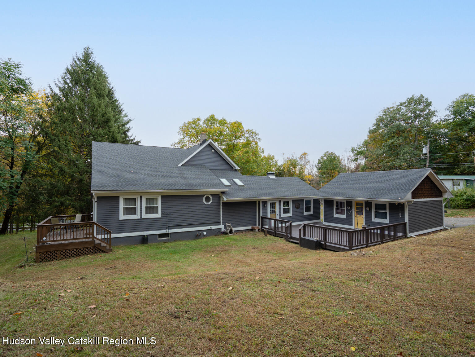8 Creekside Road Hopewell Junction, NY 12533 - Photo 6 of 34 a front view of a house with a yard and lake view