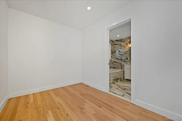 a bedroom with a bed and dresser