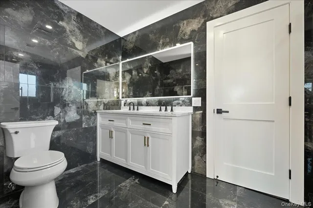 a big room with wooden floor and natural light