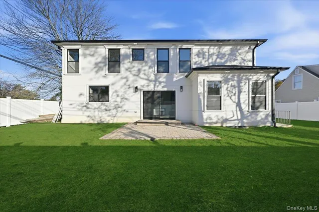 a view of yard with swimming pool and sitting area