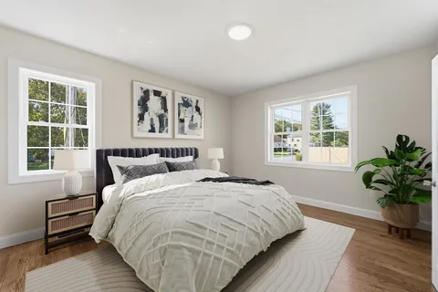 a bedroom with bed and a window