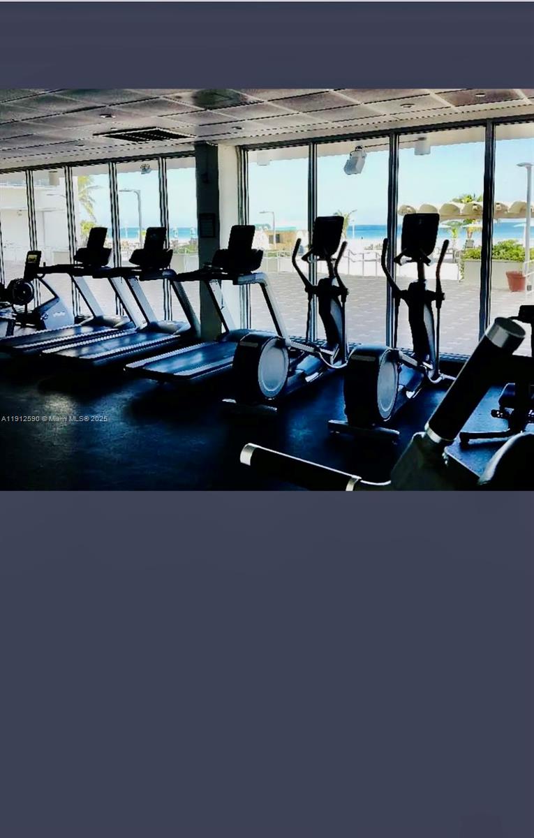 5701 Collins Avenue, Unit PH10 Miami Beach, FL 33140 - Photo 22 of 24 a view of a living room and hall with furniture