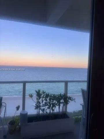 a view of a balcony with an outdoor space