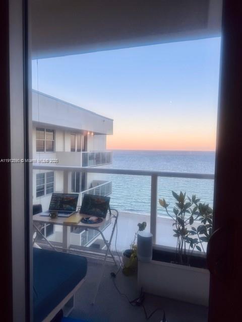 5701 Collins Avenue, Unit PH10 Miami Beach, FL 33140 - Photo 9 of 24 a view of a living room and kitchen with furniture