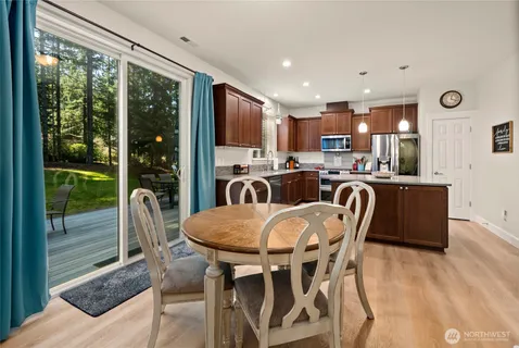 a view of a dining room with furniture window and outside view